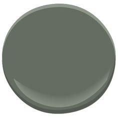 a dark blue paint color is shown in this round image with the top half painted