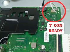 the motherboard is being removed from the laptop with a t - con ready sticker