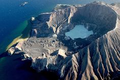 an aerial view of a large crater in the ocean