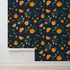 an orange wallpaper with flowers and leaves on a black background in a living room