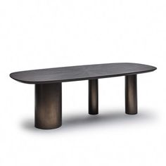 an oval table with two black legs and a wooden top, in front of a white background