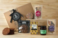 an assortment of snacks and treats in a gift box