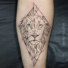 a lion tattoo on the leg with blue eyes and an origami style design