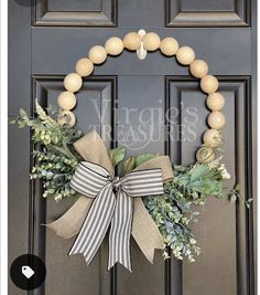 a wreath is hanging on the front door