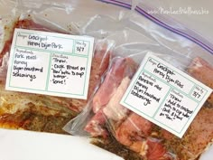 two packaged meats sitting on top of a table next to each other in plastic bags