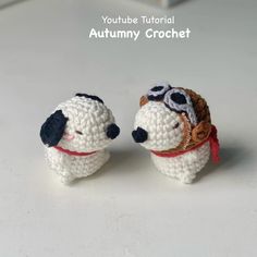 two small crocheted dogs with sunglasses on their heads are sitting next to each other