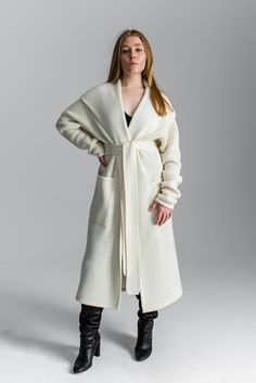 "White cardigan Light coat Oversized cardigan Chunky sweater Basic clothing Chunky loose knitwear Long coat Minimal clothing Kimono cardigan One size fits for XS-M/L Free shipping worldwide This item can be made in any size and color (1-2 weeks for production). Contact us, and we will advice about color availability and measures required. The wool is machine washable with program of \"wool\" or \"delicate\" Low temp. 30o Designed & Created by Gurenkova Knitwear" Oversized Long Outerwear In Winter White, Elegant Long Knit Outerwear, Chic Open Front Sweater Coat For Winter, Chic Shawl Collar Sweater Coat For Spring, Chic Spring Sweater Coat With Shawl Collar, Elegant Long Oversized Sweater Coat, Elegant Long Knit Sweater Coat, Elegant Oversized Knit Outerwear, Oversized Long Sweater Coat For Winter