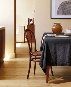 a dining room table with a black cloth on it