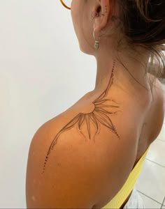 a woman with a tattoo on her back