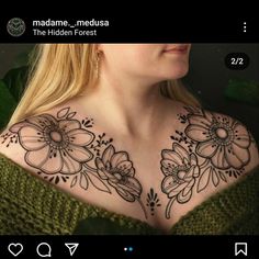 a woman's chest with flowers on it