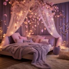 a bed with pink and white decorations on the headboard, lights in the background