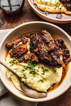 two bowls filled with meat and mashed potatoes