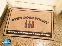 an open door policy mat on the floor with beer bottles and blue eyes in it