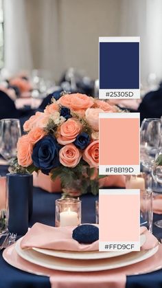 the table is set with pink and blue flowers