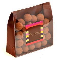 a brown bag filled with lots of chocolate balls