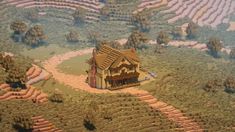 an aerial view of a house in the middle of a field with trees and bushes