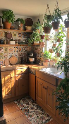 A cozy boho kitchen, with mismatched wooden cabinets, patterned tile backsplash, and hanging plants everywhere. Natural light pours in, highlighting the colorful, eclectic decor, and a cozy nook in the corner for morning coffee. hd quality, natural look --ar 9:16 --style raw --v 6.1 70s Home Aesthetic Kitchen, Indie Kitchen Retro Vintage, Indie Apartment Aesthetic Kitchen, Fun House Decor Ideas, Earthy House Interior, Cozy Maximalism Apartment, Earthy Boho Kitchen, Cute House Items, 70s Aesthetic Kitchen