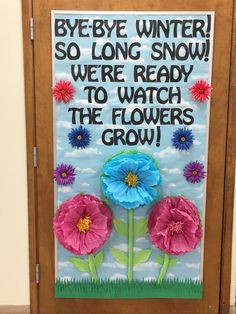 a door decorated with flowers and the words bye bye winter so long snow we're ready to watch the flowers grow