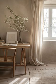 a room with a desk, chair, and window in front of the curtained window