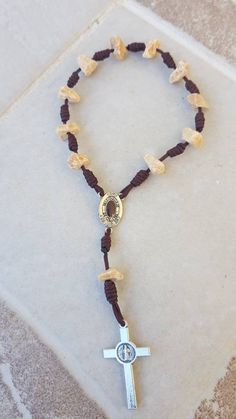 Handcrafted stone rosary from Medjugorje. One decade of rosary. Each stone is natural, different and unique. Stones are irregular in shape. Beads of stone are approximately 14 mm in size. You can choose centerpiece: 1. Virgin Mary /Divine Mercy in color 2. Virgin Mary/ Soil of Medjugorje. Cross size is 4cm (1.58 inch) Rosary is 20cm ( inches) long. This unique rosary is perfect gift for home, office, for occasion like anniversary, wedding, birthday, baptism, first communion or confirmation... ** Bohemian Rosary Bracelet For Healing With Natural Stones, Bohemian Rosary Bracelet With Natural Stones For Healing, Bohemian Rosary With Natural Stones For Gifts, Adjustable Natural Stones Rosary For Meditation, Adjustable Spiritual Rosary For Healing, Handmade Spiritual Healing Rosary, Bohemian Hand-strung Rosary For Healing, Bohemian Hand-strung Healing Rosary, Spiritual Gemstone Beads Rosary