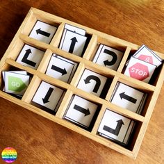 a wooden box filled with different types of magnets