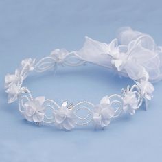 a white headband with flowers and pearls