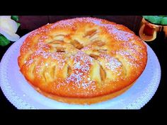 a cake on a plate with powdered sugar