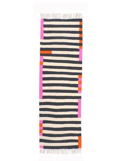 a black, white and pink striped rug with fringes