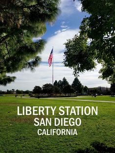 the liberty station in san diego, california with an american flag flying high above it