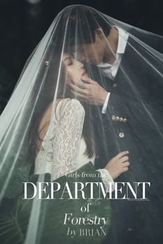 a man and woman kissing under a veil in front of the words department of forestry