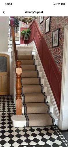 the stairs in this house are lined with black and white tiles