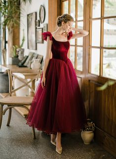 Product Information:Dress Number: GS2WMaterial: Tulle, VelvetSilhouette: A-lineColor: Wine RedHemline: Tea LengthBack Detail: Lace-upNormal Order Delivery time:Tailoring Time: 2-3 weeksShipping time: 3-5 working daysFor normal order, you can receive your order in 3-4 weeks.Rush Order:Rush order service is available. For rush order, you can receive your order in 14 working days.Custom Size:We offer free custom size service. Please leave us the following measurements according to the measuring guide:Bust: ________inch/cm,Waist: ________inch/cm,Hips: ________inch/cmHollow to knee( for knee length dress only):________inch/cmHollow to Floor(without shoes): ________inch/cm Your Height without shoes______ inch/cmThe Shoes height you will wear with the dress:______ inch/cm Elegant Christmas Tulle Dress, Red A-line Tulle Dress, Red Fitted Tulle Dress, Fitted Red Tulle Dress, Burgundy Ball Gown Evening Dress For Party, Burgundy Tulle Evening Dress, Burgundy Tulle Dress For Prom Season, Red Party Ball Gown, Red Ruffled Gown For Banquet