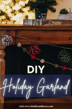 a holiday garland with pine cones hanging from it and the words diy holiday garland