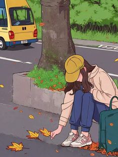 a woman kneeling down next to a tree with leaves on the ground and a yellow van in the background