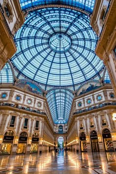 the inside of a large building with glass ceiling