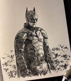 a drawing of the batman in black and white