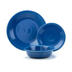 three blue bowls are stacked on top of each other in front of a white background