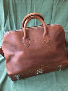 I am excited to offer this rare early Sac Mallette by Hermes.  It dates to the 1930s and its condition shows that it lived a varied life in those 90 years! I want to be completely transparent about the scrapes and wear and have posted as many photos as I could.  I have plenty more and I’m happy to share them with you on request. I am pricing this beautiful and important piece of Hermes history consistent with its condition.  If you have ANY questions or concerns about the bag, please contact me and let’s see if I can get them answered.  The piece is sold ‘as is’ and sale is final. Hermes History, Hermes Travel Bag, Sticky Fingers, Vintage Hermes, Hermes Bag, Travel Bag, Bags Handbags, Dates, Satchel