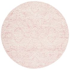 a round rug with pink and white designs on the bottom, in front of a white background