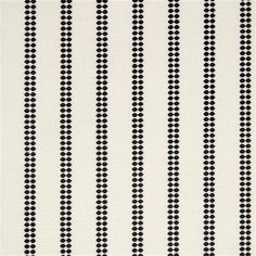 a white and black striped wallpaper with dots on the bottom, in rows of circles