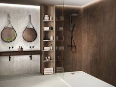 a bathroom with two round mirrors on the wall and shelves in front of it,