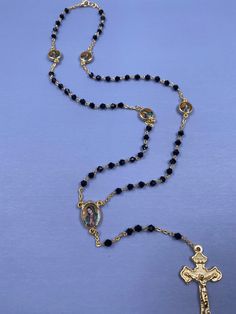 Virgin Mary Black Diamond and Gold Rosary Necklace / Collar de oro y diamante negro de La Virgen de Guadalupe Rosario Black Crucifix Jewelry For Jewelry Making, Crucifix Jewelry With Black Beads As Gift, Adjustable Black Cross Jewelry, Black Round Spiritual Jewelry, Elegant Black Crucifix Jewelry, Black Rosary Aesthetic, Black Spiritual Cross Jewelry, Spiritual Black Cross Jewelry, Rosario Necklace