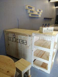 a counter made out of wooden pallets and some stools