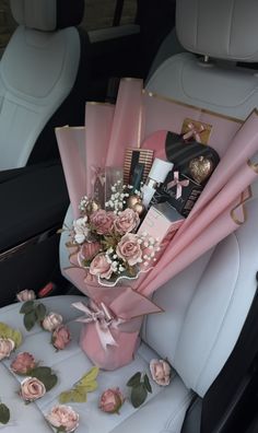 a bouquet of flowers in the back seat of a car