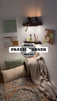 a bed with blankets and pillows on top of it next to a wall that says make a prayer corner with me