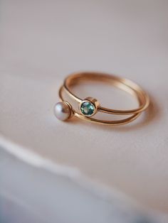 Two simple stacking rings on thin gold bands, one small white and lustrous pearl and one bezel set Alexandrite. Pearl Ring Designs Unique Gold, Baby Rings Gold, Pearl Ring Designs, Sapphire Ring Designs, Modern Gold Ring, Small Earrings Gold, Jewelry Set Design, Single Pearl