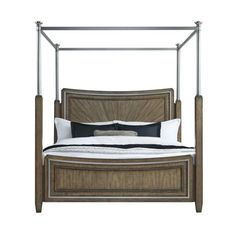 a bed with a metal frame and wooden headboard on it's sides, in front of a white background