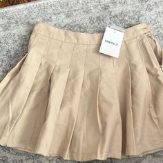 Brand New, Khaki Pleated Skirt. Size Is 9/10 But It Runs Small, I’d Say Fits Like A Size 8 Pleated Mini Skort For School, Preppy Mini Skirt For School Summer, Preppy Mini Skirt For School And Summer, Trendy Short Tennis Skirt For School, Cotton Pleated Skort For School Uniform, Casual Summer Pleated Skirt For School, Casual Pleated Skirt For School In Summer, Casual Summer School Pleated Skirt, Trendy Cotton Skirt For School