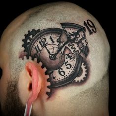 a man with a clock tattoo on his head