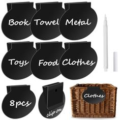 black chalkboard labels with white writing on them and a wicker basket next to it